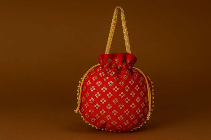 Handcrafted Silk-Blend Potli Bag with Golden Zari Motifs & Pearl Handle