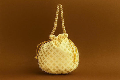 Handcrafted Silk-Blend Potli Bag with Golden Zari Motifs & Pearl Handle